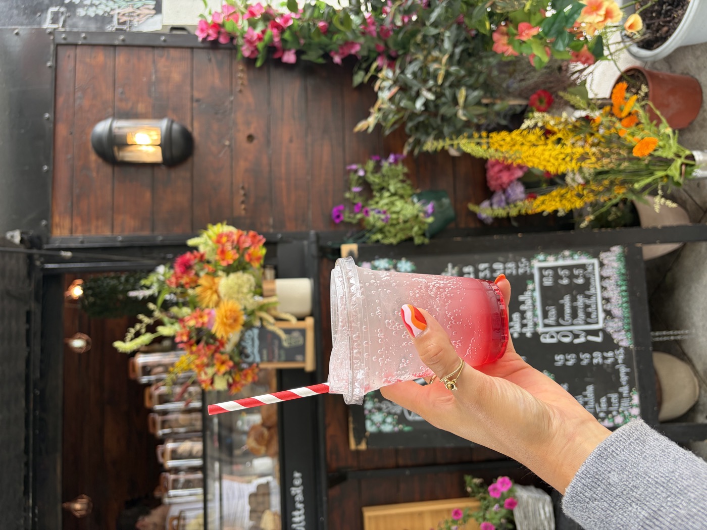 A pink lemonade with a striped straw at the Trailer