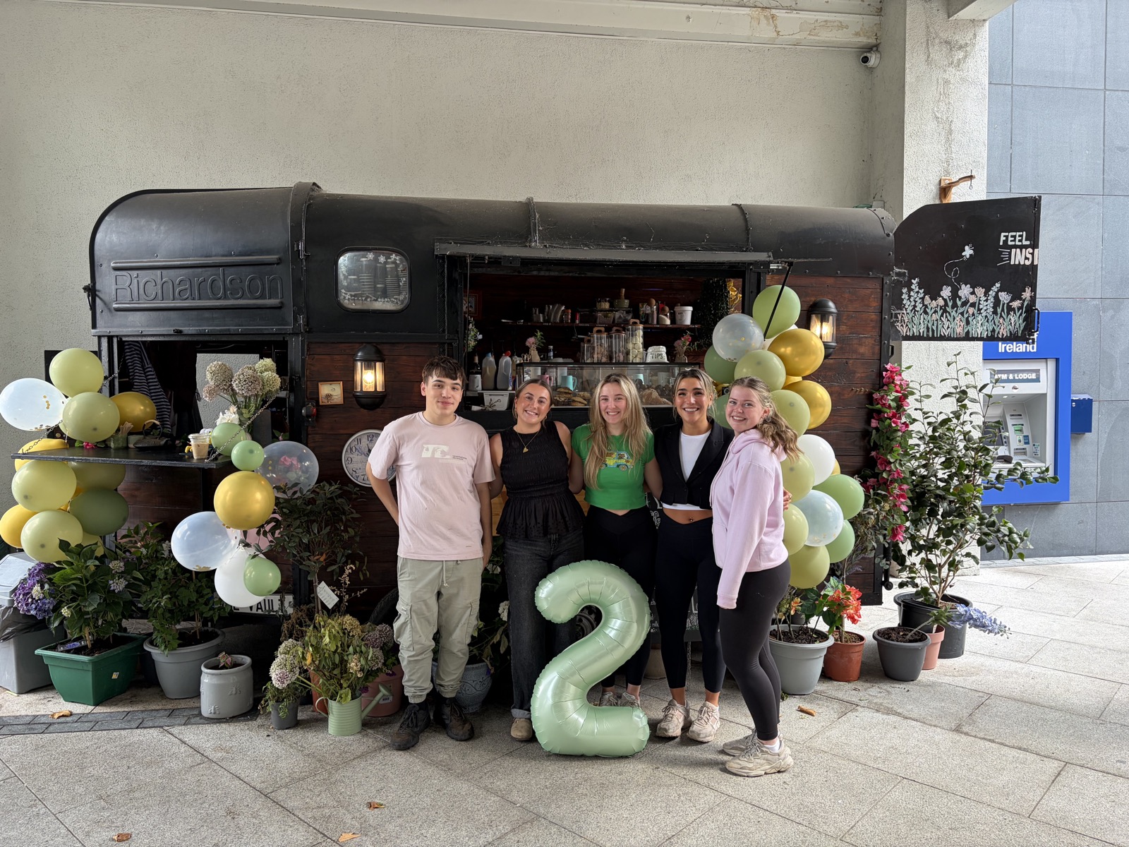 The team celebrating the Trailer's second birthday with balloons